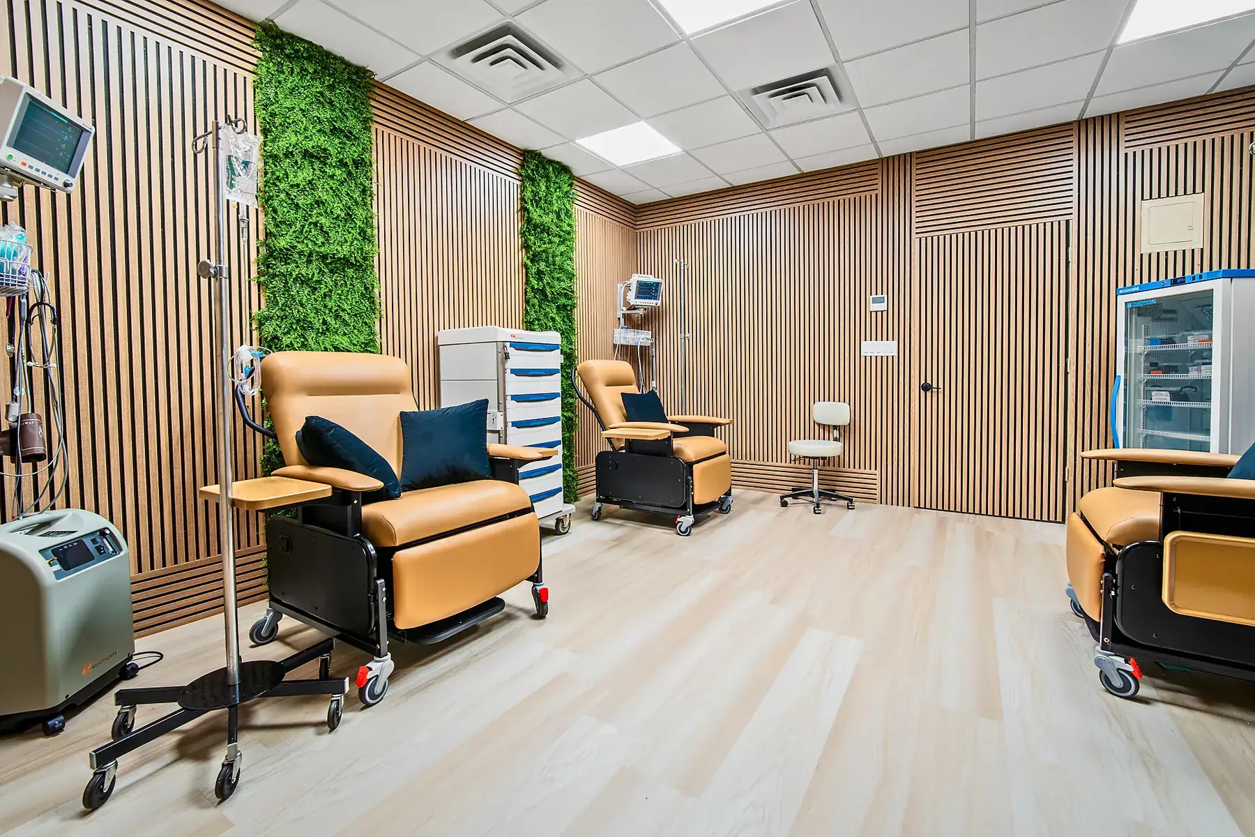 Treatment chairs and an IV stand inside the infusion room